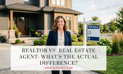 Real estate agent standing outside a home with a for-sale sign, illustrating the difference between a Realtor and a real estate agent