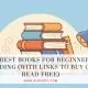 Stack of colorful books with a mug and lamp, illustrating the best books for beginners reading